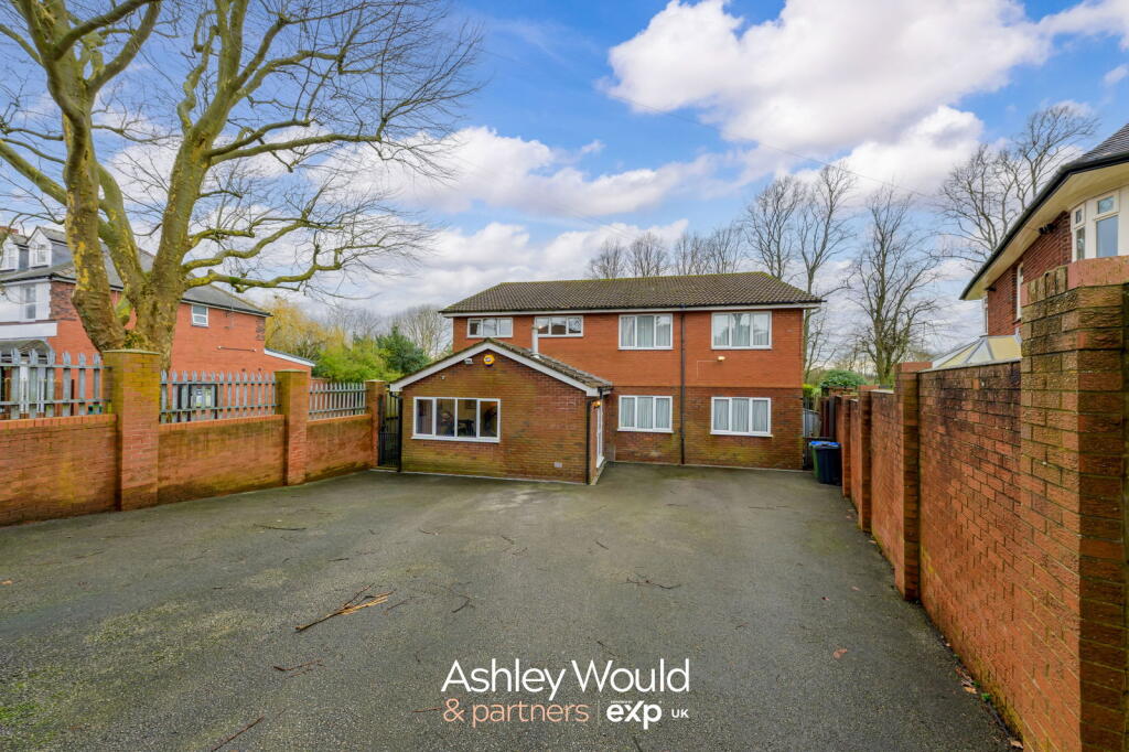 Multi-car driveway and front of the house